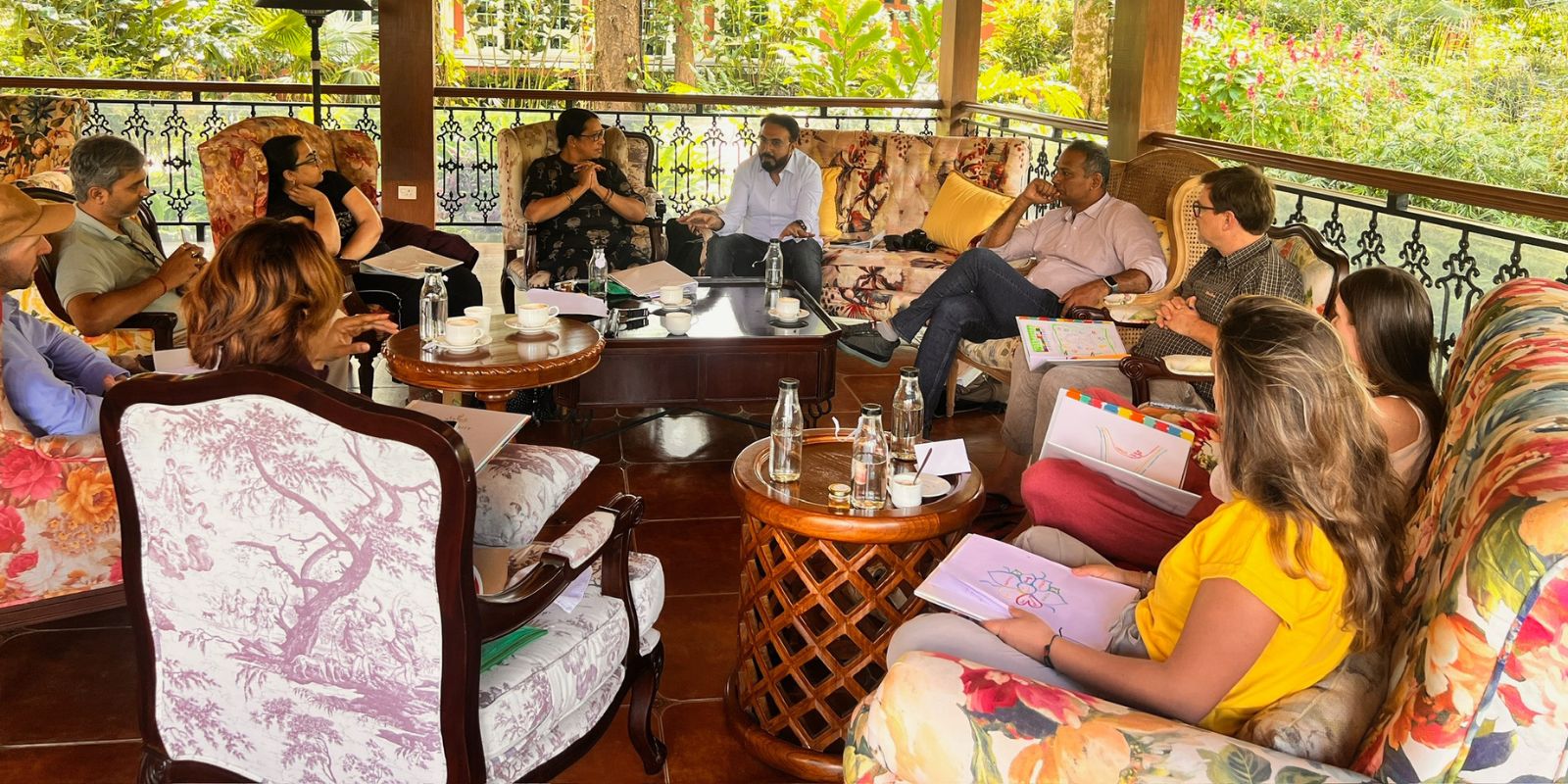 Diverse group of leaders smiling together in a bright workshop setting